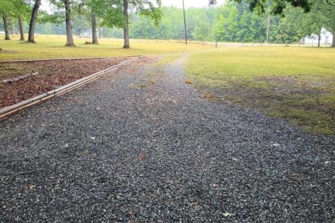 log house driveway to road 07-24